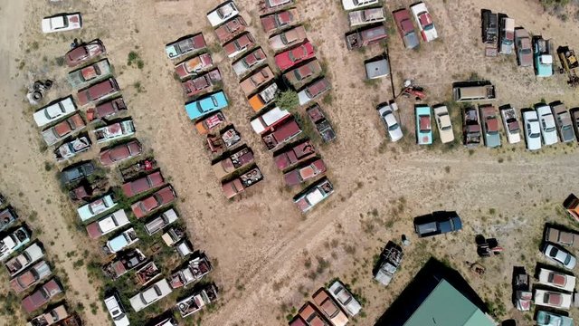 Overhead view of old cars gathered in a countryside parking