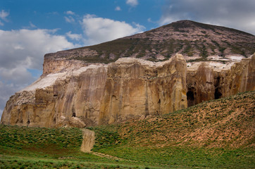 West Kazakhstan. In the boundless steppe there is a lonely mountain complex Shirkala, which from a distance looks like a Yurt.