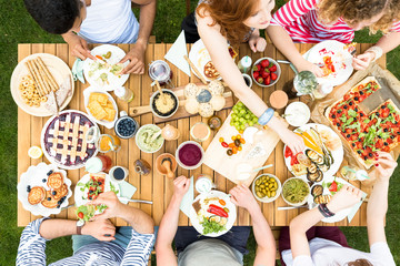Top view on garden table with food during friend's party © Photographee.eu