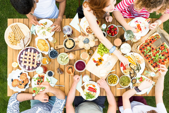 Top view on garden table with food during friend's party