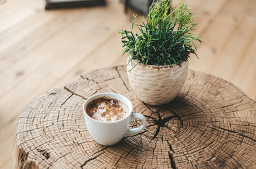 aromatic black coffee on a wooden table, coffee for breakfast in a white cup