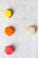 Colorful macarons on light grey background