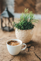 aromatic black coffee on a wooden table, coffee for breakfast in a white cup
