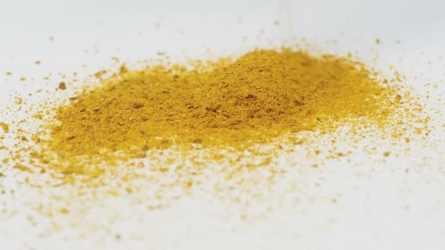 Falling down saffron.
Video footage of pouring on the surface of orange spice.