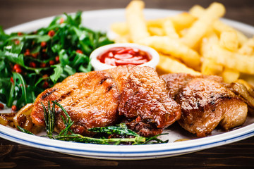 Grilled beefsteak with french fries and vegetable salad