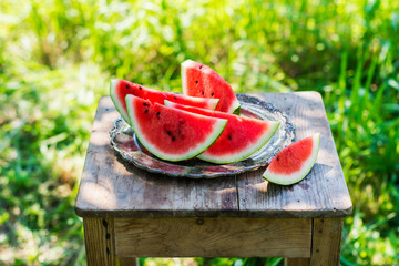 Watermelon slices in the garden © happy_lark