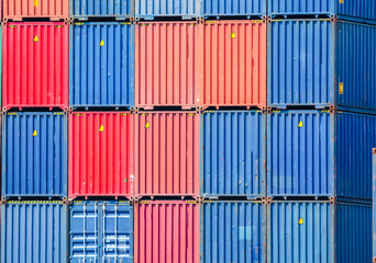 Stacked containers in a shipping terminal