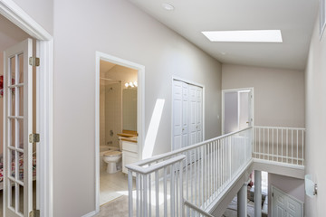 Light beige hallway with skylight.