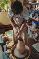 Creating a jar or vase of white clay close-up. Master crock.