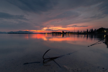 Sunset on Lap An lagoon and Lang Co Bay with colorful layers of cloud and . Lang Co Bay is one of the famous and beautiful bays of the world. HUE - VIET NAM