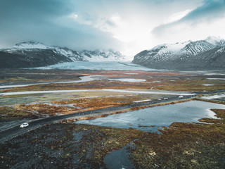 Vatnajokull glacier aerial drone image with clouds and blue sky. Dramatic winter scene of Vatnajokull National Park, Iceland, Europe. Beauty of nature concept background.