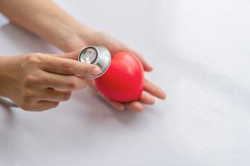 Photo of nurse, women hand using a stethoscope in motion of measuring a red heart on other hand...
