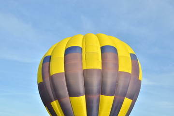 Naklejka premium Close up of a colorful air balloon in blue sky.
