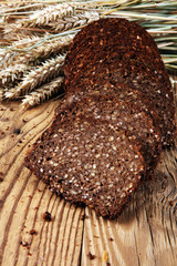 bread on wooden board from above. Kitchen or bakery poster design.