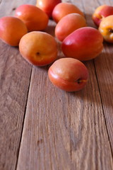 Fresh apricots on wooden surface