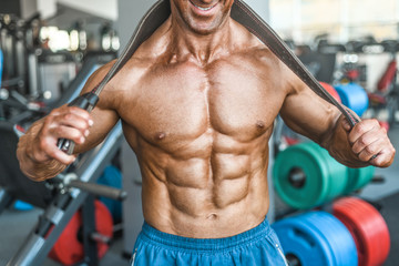 Naklejka premium Brutal aged strong bodybuilder athletic men pumping up muscles with dumbbells