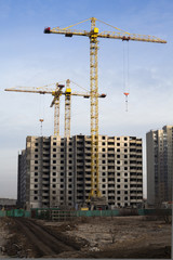 Tower cranes and high-rise building