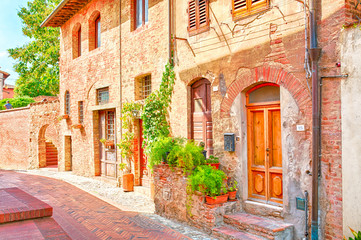Fototapeta na wymiar Beautiful old terracotta colored houses in Italy.
