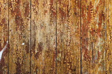 Old boards with cracked rusty paint. Textured wooden old background with vertical lines