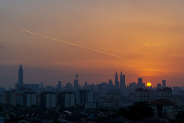 Fototapeta premium Majestic sunset over KL Tower and surrounded buildings in downtown Kuala Lumpur, Malaysia.