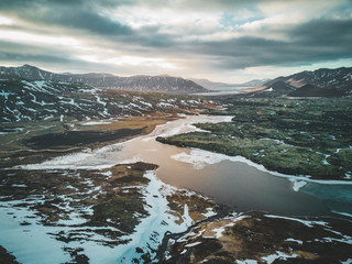 Aerial drone photo of a empty lake a huge volcanic mountain Snaefellsjokull in the distance, Reykjavik, Iceland.