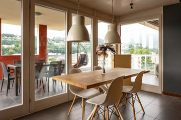 Detail of table with design chairs