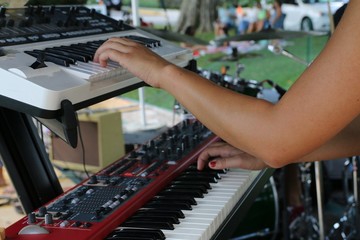 Playing the small piano creates great sounds for the audience.