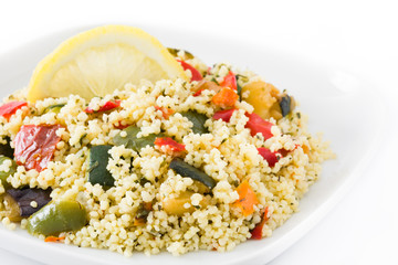 Couscous with vegetables isolated on white background