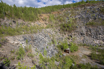 Fototapeta na wymiar Quartz and mica ore open pit quarry mining technology