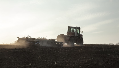 Harrowing the soil with disc harrows