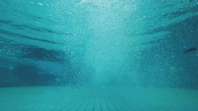 Jump into swimming pool from bottom