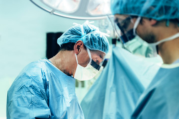 Team of Surgeons Operating