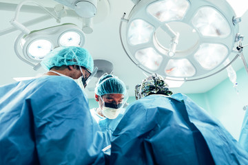 Team of Surgeons Operating
