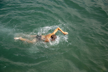 Children swim in the sea