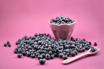 Fototapeta na wymiar Blueberries in a bowl stock images. Blueberries on a purple background. Healthy summer fruit