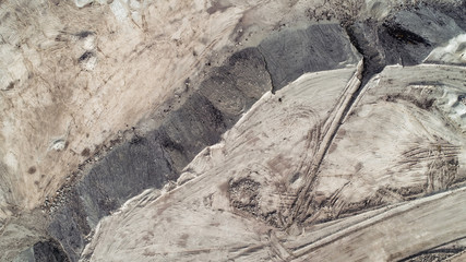 Aerial view on open pit mine of sand, hummus and coal