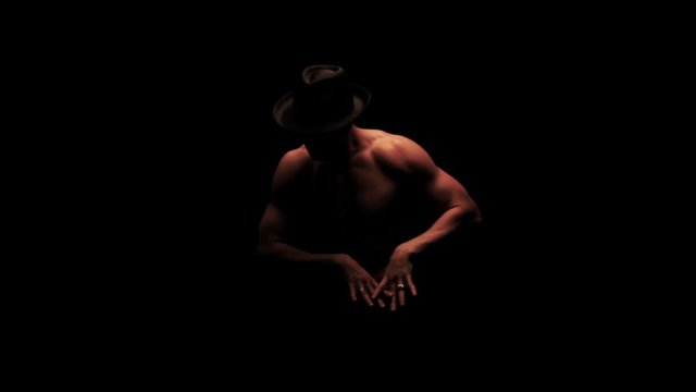 Silhouette of a man dancing in the dark