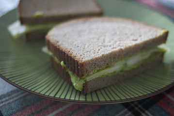Sandwich with green peas hummus and cheese