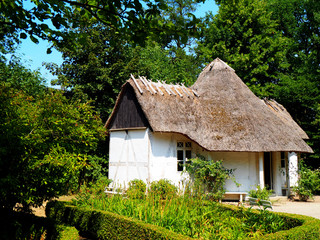 Fototapeta na wymiar Small thatched farm building