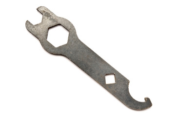 Old wrench isolated on white background.
