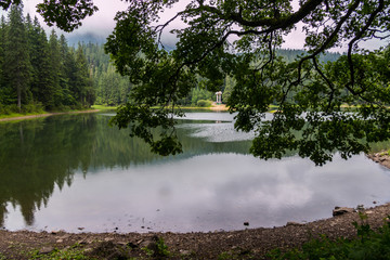 A commemorative sign on the opposite shore of the lake