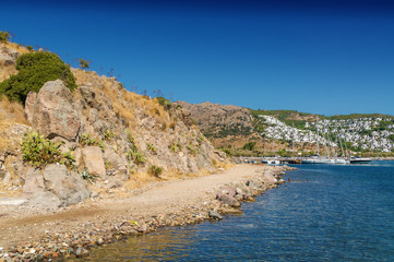 Fototapeta premium Sunny view of the beach at Ortakent near Bodrum, Mugla, Turkey.