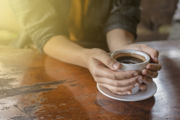 Coffee cup in hand woman.