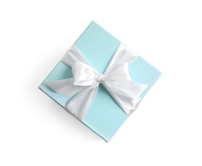 Gift box with ribbon on white background, top view