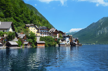 Picturesque view of small resort town near mountains on riverside