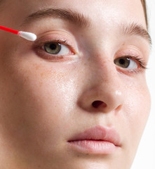 Naklejka premium Beautiful portrait of the young woman close up. Natural beauty, ideal skin, natural cosmetics. Cosmetology, Spa procedures, health, care of skin