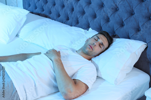Young Man Sleeping In Bed At Night Stockfotos Und