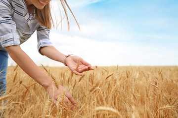 Young agronomist in grain field. Cereal farming