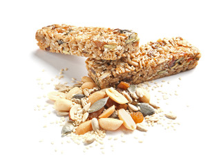 Grain cereal bars with nuts and raisins on white background