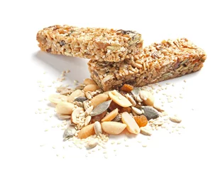 Deurstickers Grain cereal bars with nuts and raisins on white background © New Africa